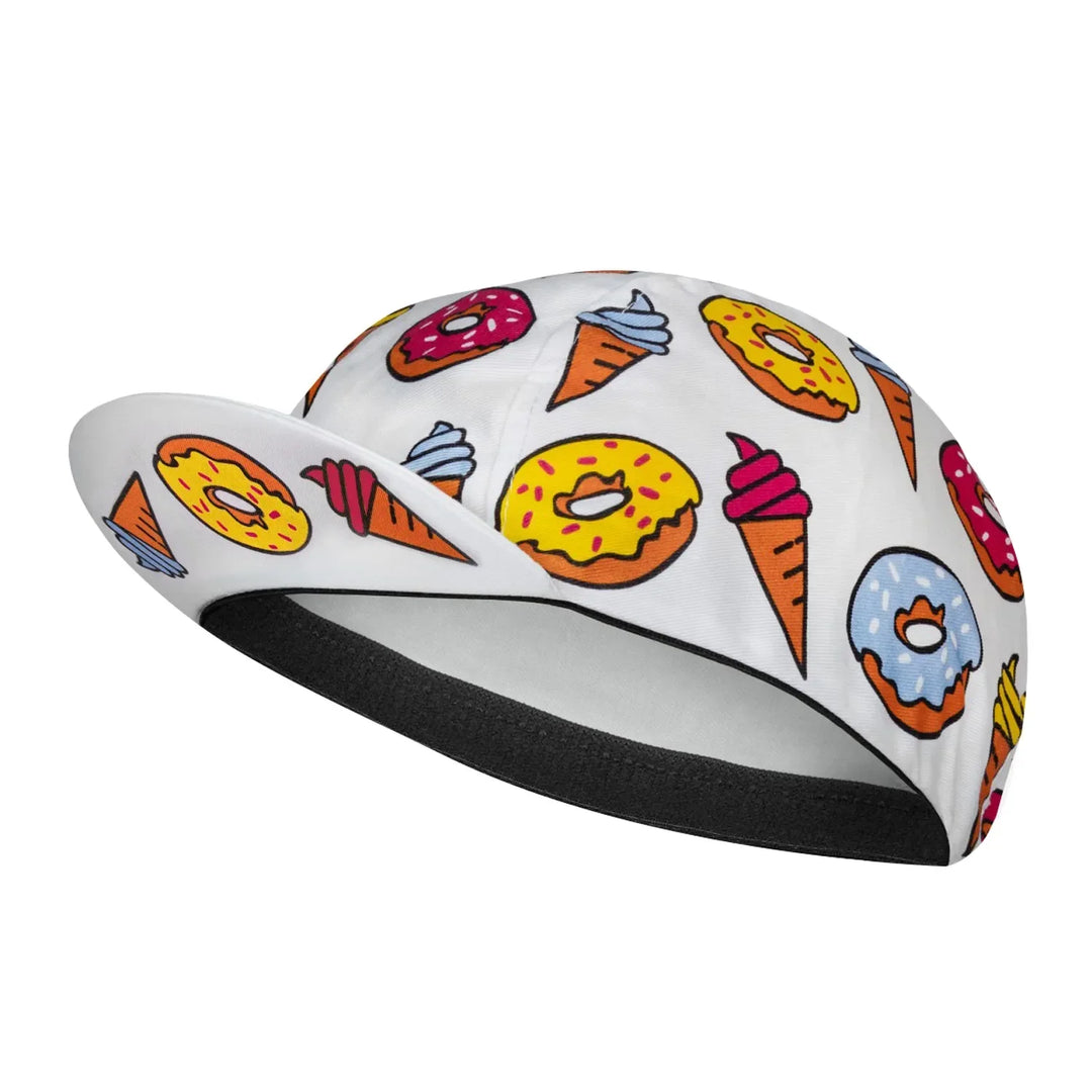 A white cycling cap featuring colorful illustrations of donuts with pink, yellow, and blue icing, ice cream cones with pink swirls, a black interior lining, and quick-drying fabric for added sun protection.