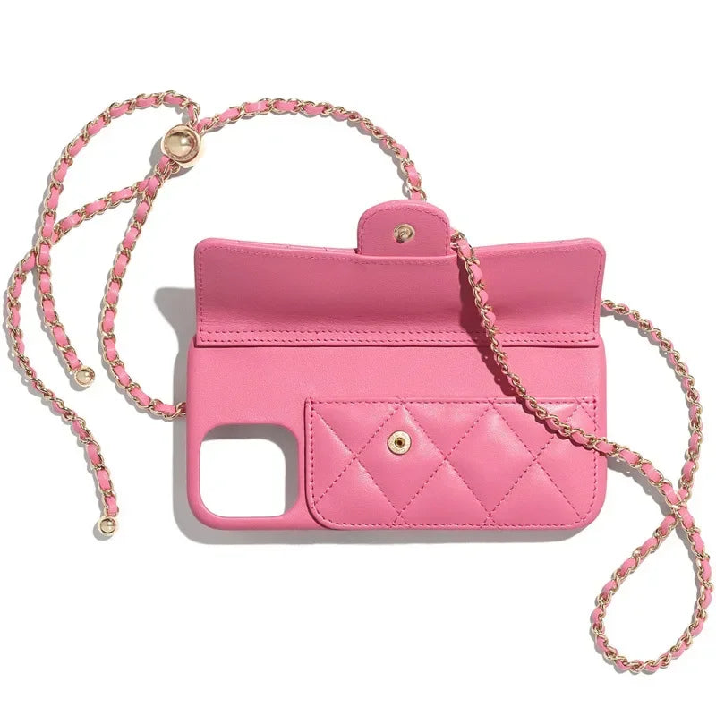 A pink quilted leather phone case with a flap, gold snap button, and a stylish pink-and-gold chain strap, displayed on a white background.