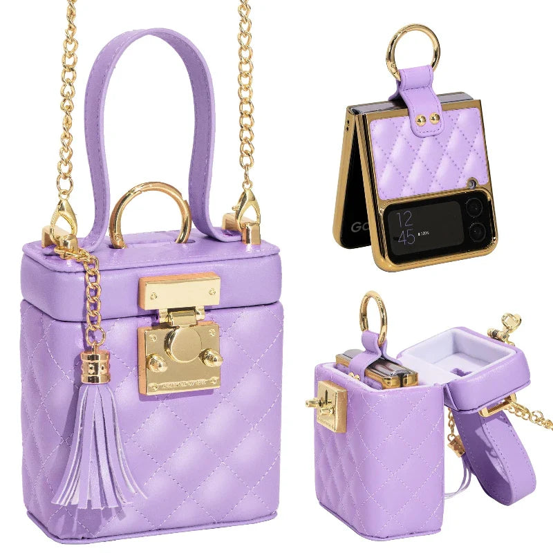 A lavender quilted purse with gold hardware, chain crossbody strap, and tassel, designed to look like a mini lockbox. The purse opens to reveal storage space and can easily fit a compact flip phone.