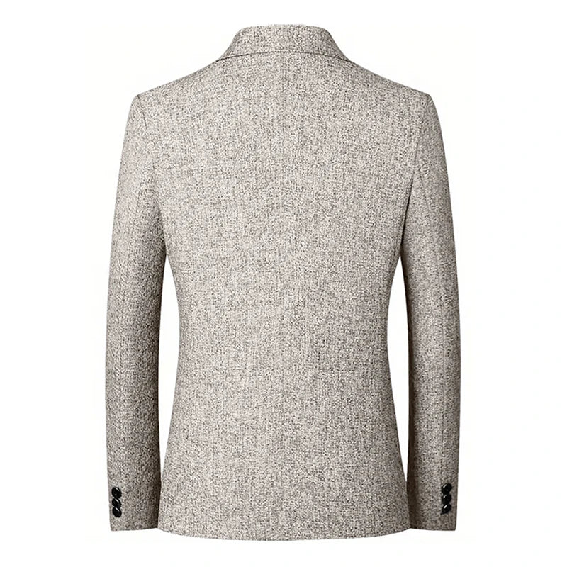 A light gray textured blazer shown from the back, featuring a straight cut, long sleeves, and two black buttons on each cuff. Crafted from breathable material, the blazer has a classic collar and a smooth, tailored appearance.