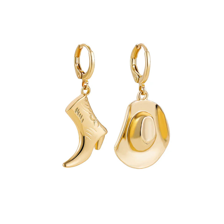 A pair of gold hoop earrings, one with a dangling cowboy boot charm and the other a cowboy hat charm—unique cowgirl accessories that bring playful western jewelry style to any look, both with shiny, polished finishes.