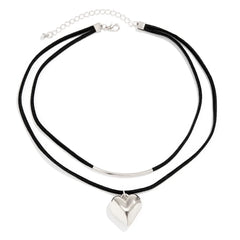 A double-layer black cord necklace features a silver metal curved bar on the upper layer and a vintage heart pendant on the lower, finished with an adjustable choker clasp for the perfect fit.