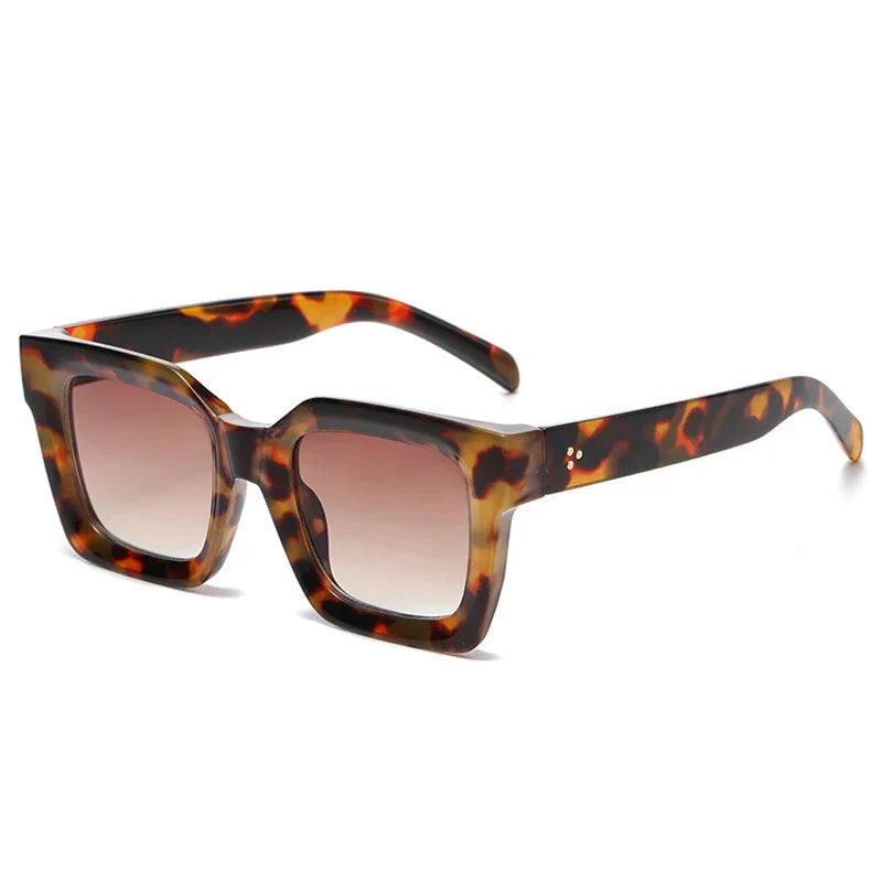 Square-framed sunglasses with thick acetate frames and brown gradient lenses, offering UV protection, shown against a white background.