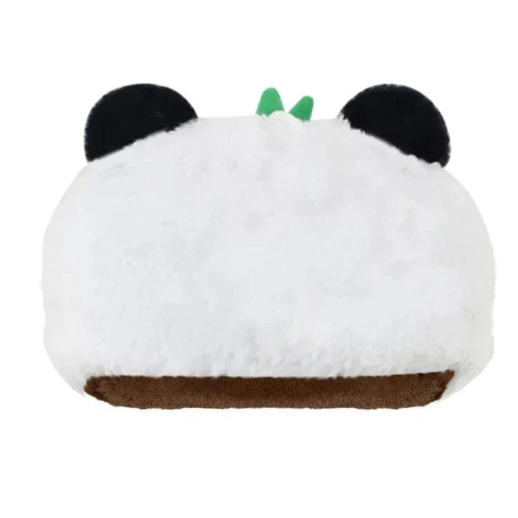 A plush pillow shaped like a panda head, featuring black ears, green felt leaves on top, and a brown bottom mouth area, all crafted from soft plush material against a white background.