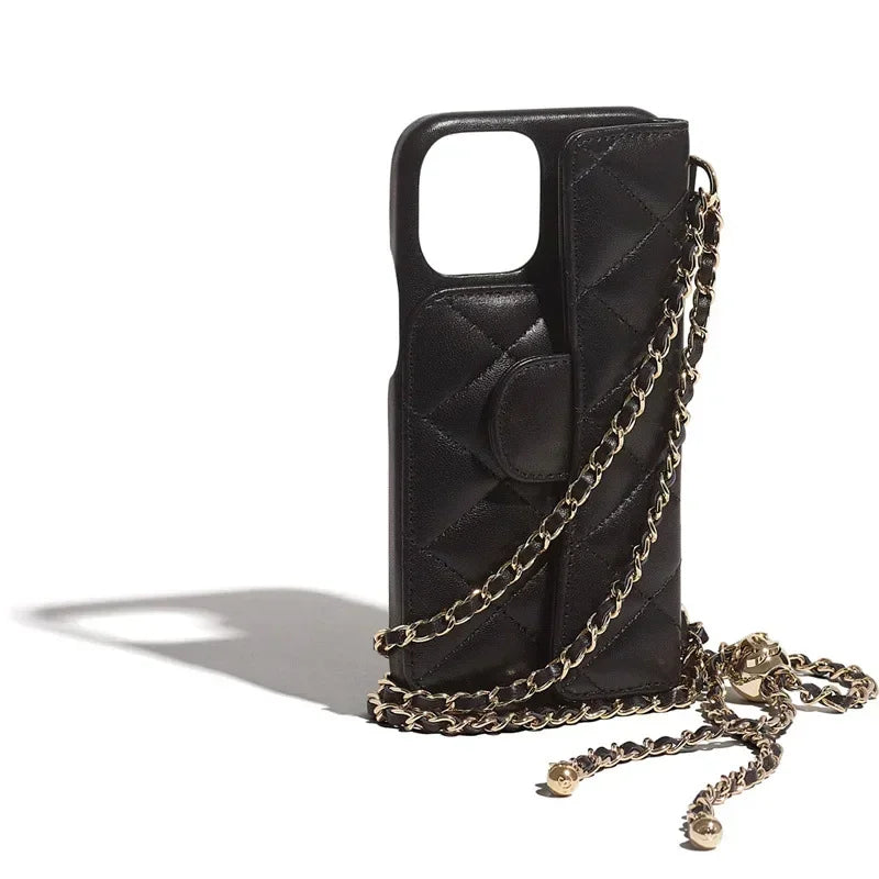 A black quilted phone case with a matching small pouch attached, featuring a stylish chain strap for carrying, displayed against a white background.