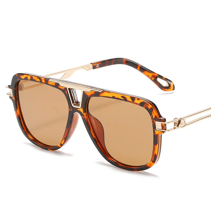 Tortoiseshell aviator vintage sunglasses with brown tinted lenses and gold metal arms, displayed on a white background.