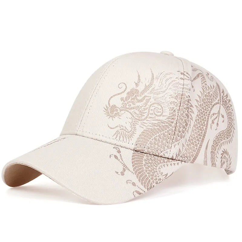 A light beige embroidered cap featuring an intricate, stylized dragon design in a slightly darker beige color on the front and side—a perfect blend of style and cultural pride.