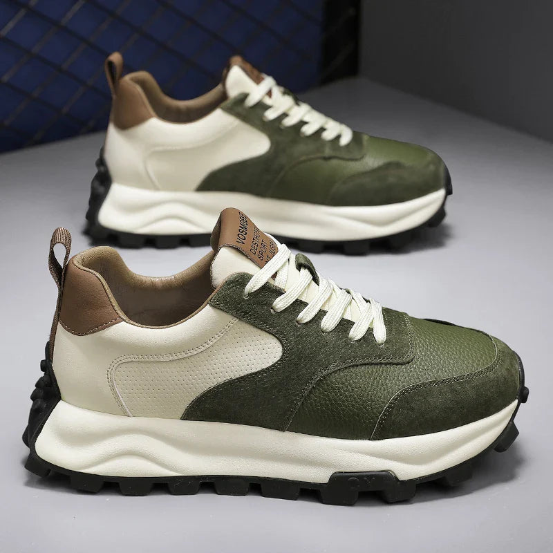 A pair of stylish Onex Street Sneakers with green and white uppers, brown accents on the heel and tongue, white laces, thick black rubber soles, and cloud-like cushioning are displayed on a light gray surface.