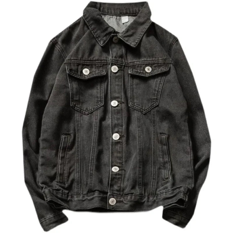 A black button-down denim jacket crafted from premium denim, featuring a relaxed silhouette, a collar, two chest pockets with flaps and buttons, two side pockets, visible stitching, and silver buttons.