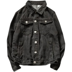 A black button-down denim jacket crafted from premium denim, featuring a relaxed silhouette, a collar, two chest pockets with flaps and buttons, two side pockets, visible stitching, and silver buttons.