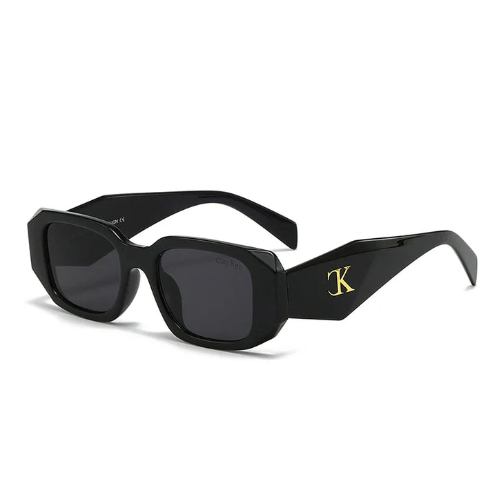 Oversized acetate sunglasses with black rectangular frames, reinforced hinges, dark UV400 protection lenses, and a gold “TK” logo on the temples, displayed on a white background.