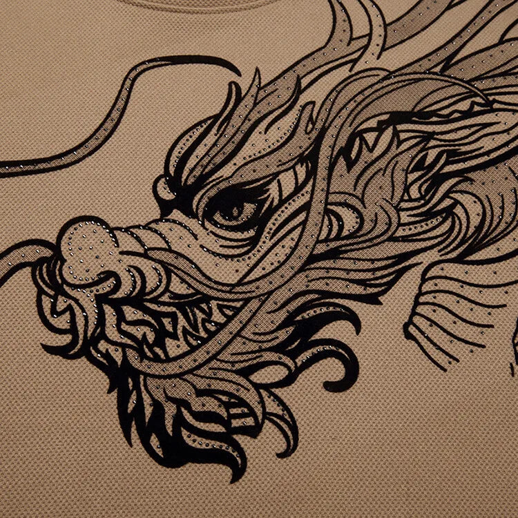 A detailed black line drawing of a dragons head is printed on beige fabric in an Asian art style, featured on an ultra-soft cotton crewneck for men, perfect for celebrating the Year of the Dragon.