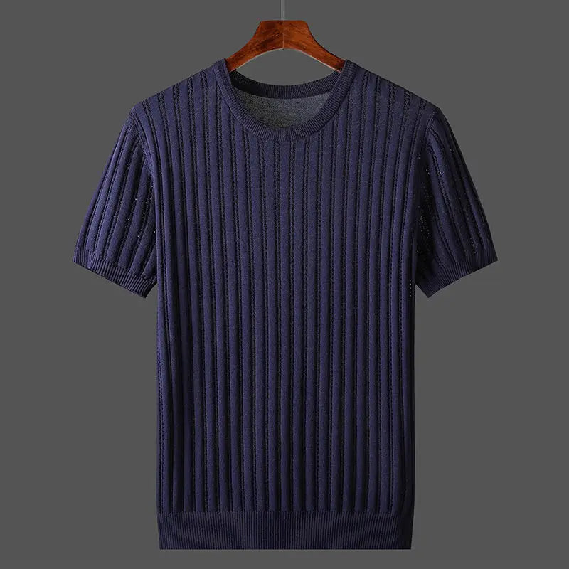 A short-sleeve, ribbed knit navy blue sweater with a classic fit hangs on a wooden hanger against a plain gray background.
