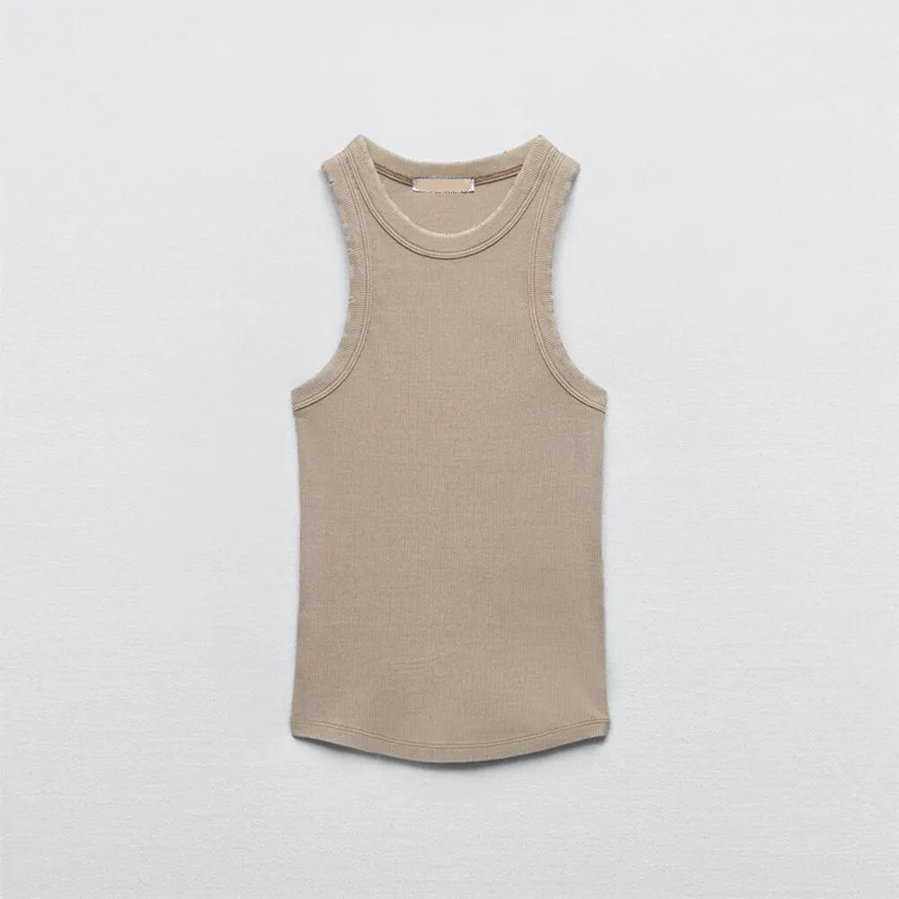 Sleeveless beige women's tank top laid flat on a light gray background, featuring a simple round neckline and fitted, casual design in soft water wash rib fabric.