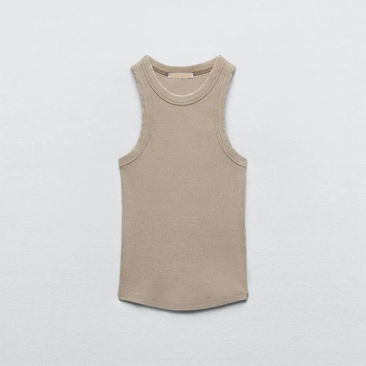 Sleeveless beige women's tank top laid flat on a light gray background, featuring a simple round neckline and fitted, casual design in soft water wash rib fabric.