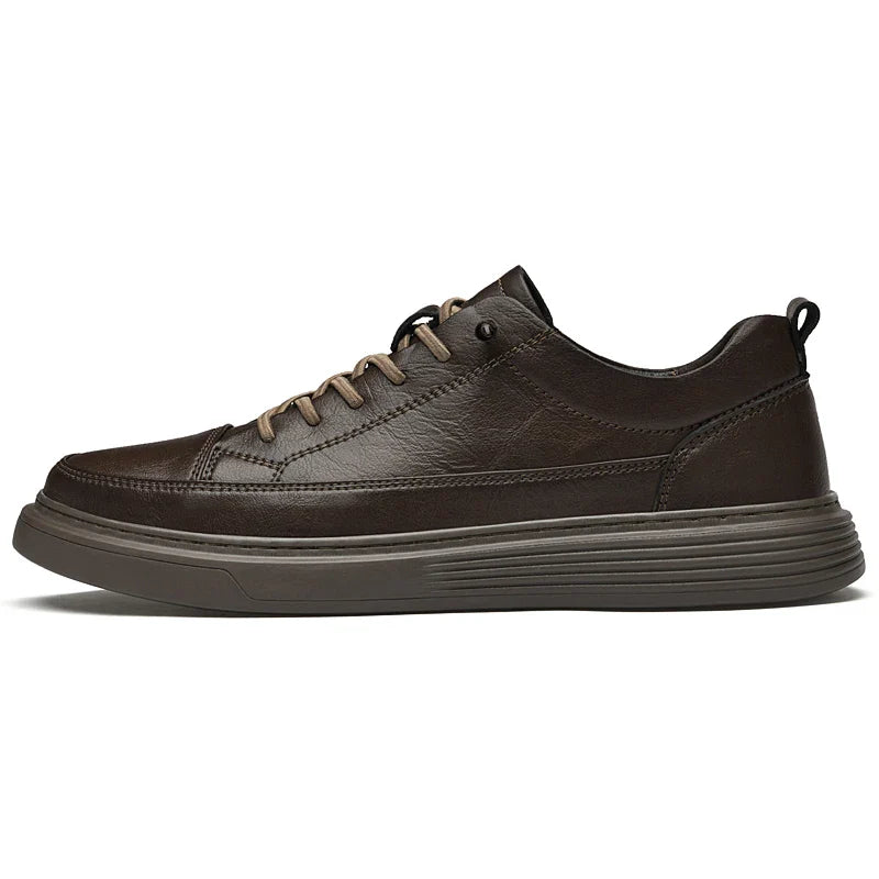 A brown genuine leather casual sneaker with matching brown laces and a textured dark brown rubber sole, shown from the side on a white background, inspired by classic Italian court shoe design.