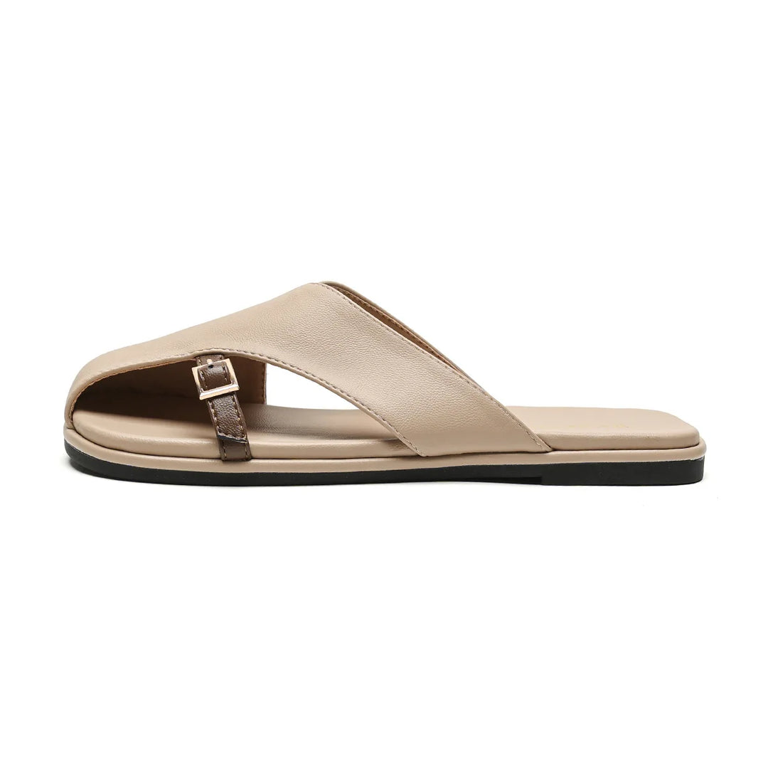 A beige open-toe leather slide sandal with a diagonal strap featuring a small buckle, flat sole, and minimalist design—perfect for elevating your summer wardrobe. Shown in a side view on a white background.