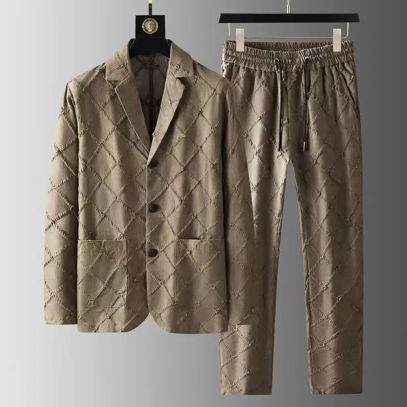 A luxury two-piece set featuring a quilted, light brown blazer and relaxed fit trousers with a diamond-patterned stitched design, displayed on black hangers against a neutral background.