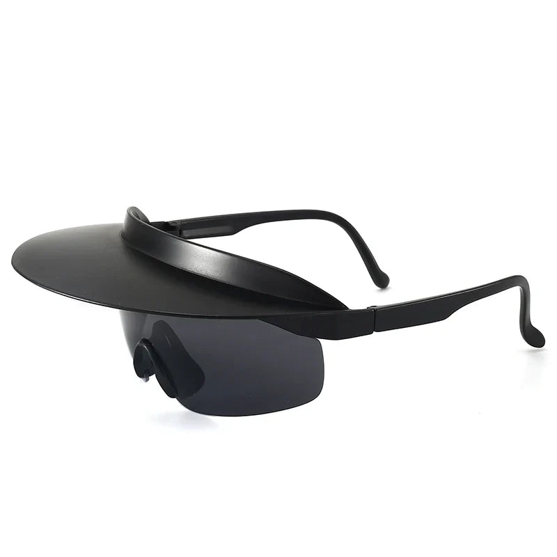 Black sunglasses with an attached wide, circular brim that extends outward, resembling a combination of a visor and sunglasses. The sleek frame features adaptive design and offers UV400 protection for stylish, modern sun defense.