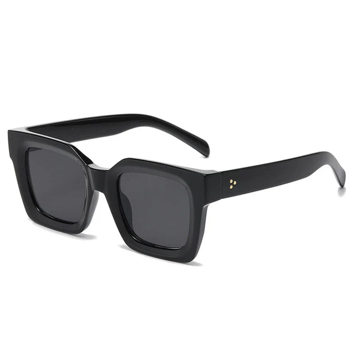 Black square-framed sunglasses with dark lenses and thick acetate frames, featuring small gold dots on the hinge area, displayed on a white background. These sunglasses offer both style and UV protection.