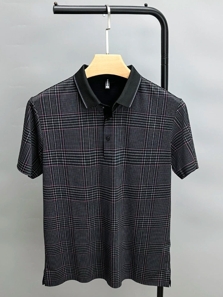 A black, breathable short-sleeve polo shirt with a subtle plaid pattern in white and red, hanging on a wooden hanger against a plain gray background.