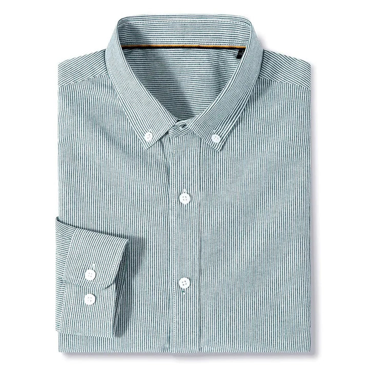 A neatly folded cotton button-up classic pinstripe shirt with thin green and white vertical stripes, a button-down collar, white buttons, and is conveniently machine washable.