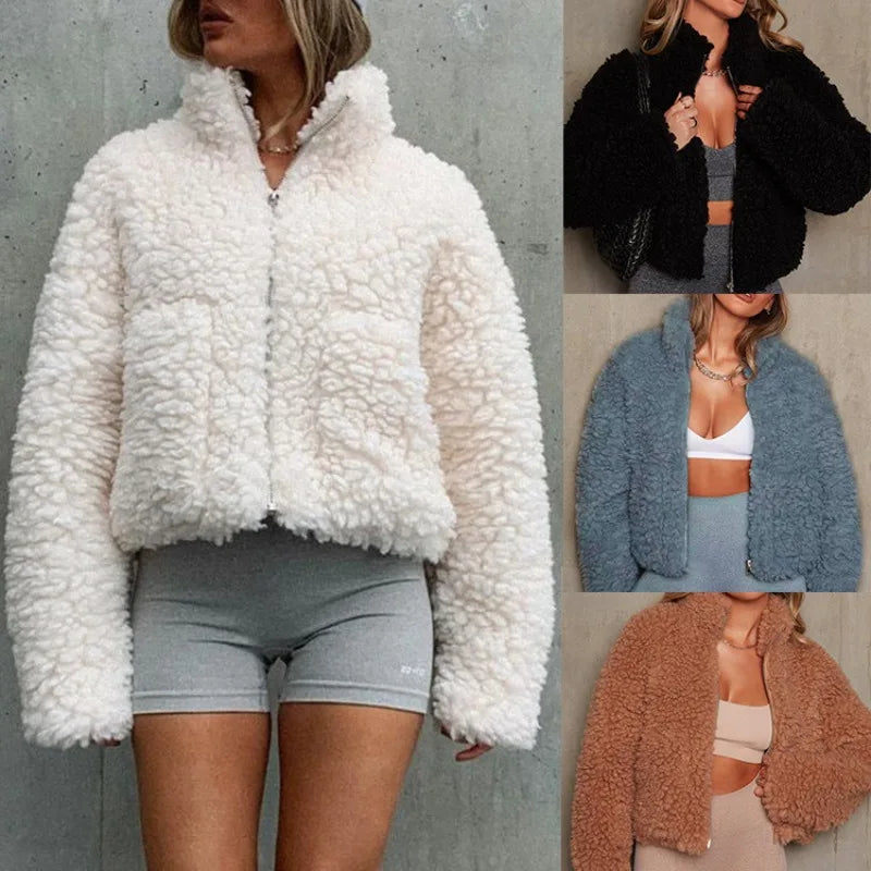 A woman wears a fluffy, sherpa-style zip-up jacket in white with a bulky cropped fit and gray biker shorts. On the right, three smaller images show this warm weightless jacket in black, blue, and brown, each styled similarly.