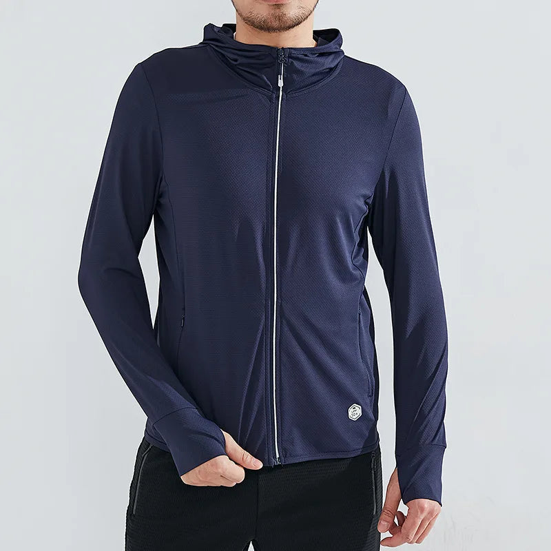 A person wearing a navy blue zip-up hoodie made of quick-drying fabric with a small circular logo near the hem, standing against a plain light background. Only the upper body is visible.