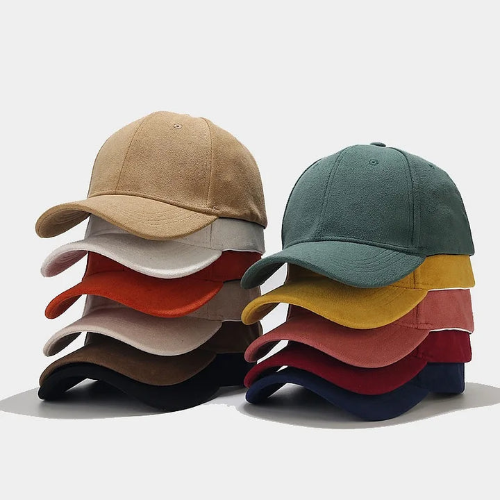 A stack of retro baseball caps arranged in two columns, each featuring six unisex streetwear caps in various colors like tan, white, red, black, green, yellow, pink, navy, and brown—all set against a plain background.