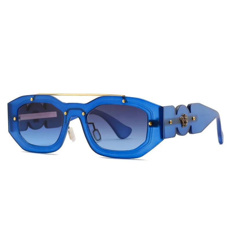 Bold blue rectangular sunglasses with thick frames, gold detailing, tinted blue lenses, and a decorative gold emblem on the temples. Features UV400 protection for optimal eye safety in style.