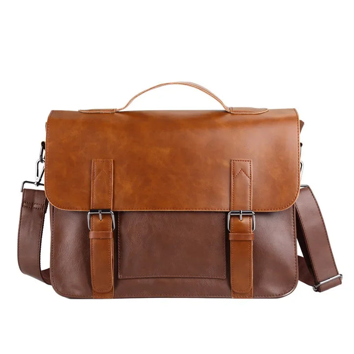 A two-tone brown satchel crafted from premium leather, featuring a top handle, adjustable shoulder strap, and front flap secured by two buckle straps. This bag boasts a classic, professional design.