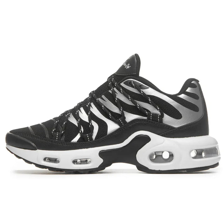 A black and white athletic sneaker with a wavy striped design, breathable mesh upper, visible air cushioning in the sole, and a low-cut silhouette.