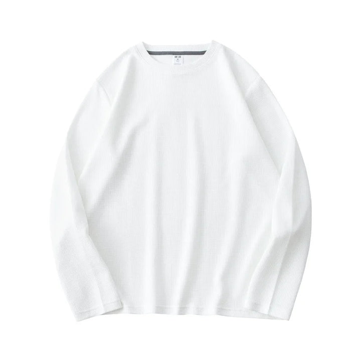 A plain white heavyweight long-sleeve shirt made from premium cotton, laid flat on a white background.