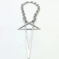 A chunky stainless steel necklace with a large geometric pendant, featuring a minimalist cross intersected by an inverted V shape—perfect as bold streetwear jewelry.
