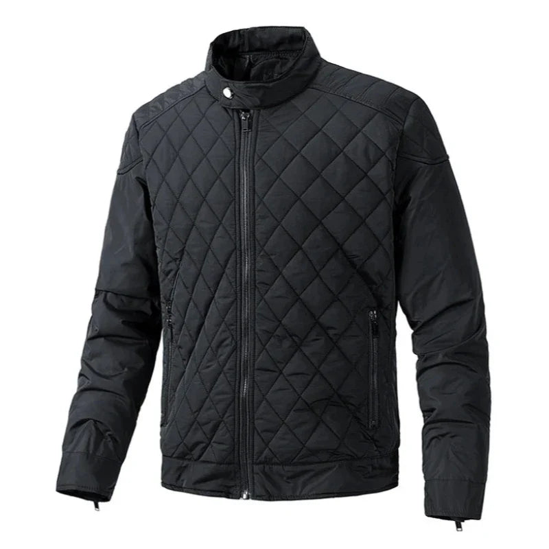 A black slim-fit quilted jacket with cotton insulation, featuring a front zipper, two zippered side pockets, long sleeves, and a stand-up collar, displayed on a plain white background.