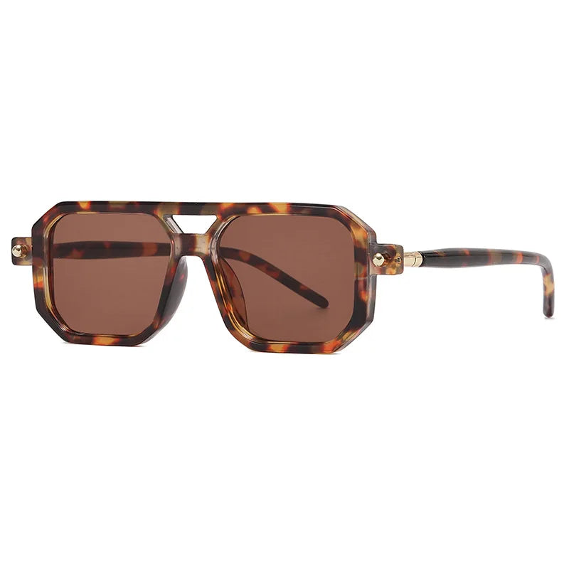 Tortoiseshell square sunglasses with a geometric silhouette, thick frames, brown lenses, and gold accents on the hinges, offering stylish UV protection against a white background.
