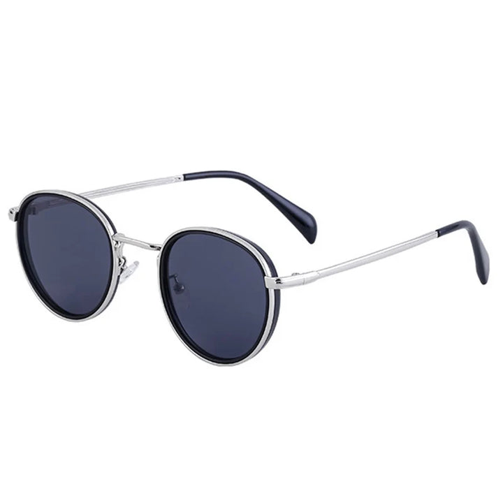 Round, silver-framed rounded sunglasses with dark, scratch-resistant lenses and thin temples, featuring black plastic tips at the ends of the arms. Offers stylish UV400 protection for your eyes.