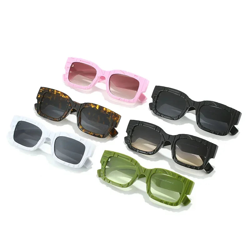 Six pairs of vintage sunglasses in different colors—pink, black, white, brown tortoiseshell, olive green, and dark green—are laid out on a white background in two rows of three, each offering UV400 protection.