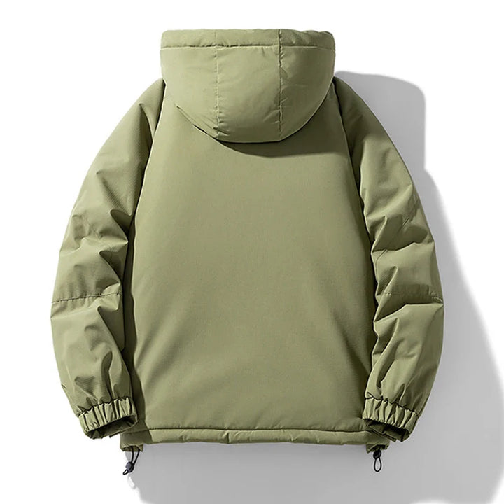 A light olive green hooded puffer jacket is shown from the back, featuring long sleeves, elastic cuffs, and a drawstring hem. This insulated jacket has a smooth texture and windproof design, set against a plain white background.
