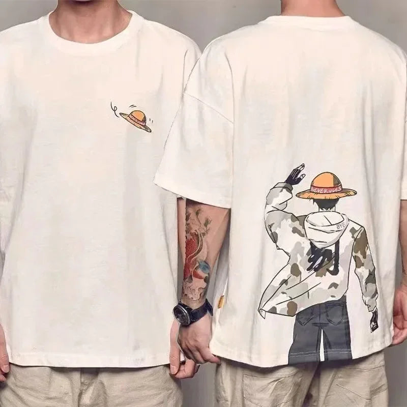 Front and back view of a white cotton knit crew neck T-shirt featuring a small straw hat graphic art on the front and a large illustration of a character in a straw hat and camouflage jacket on the back.
