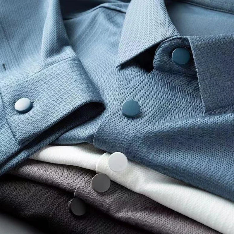 A stack of folded Spring long-sleeved shirts, perfect for a polished yet comfortable business casual look.