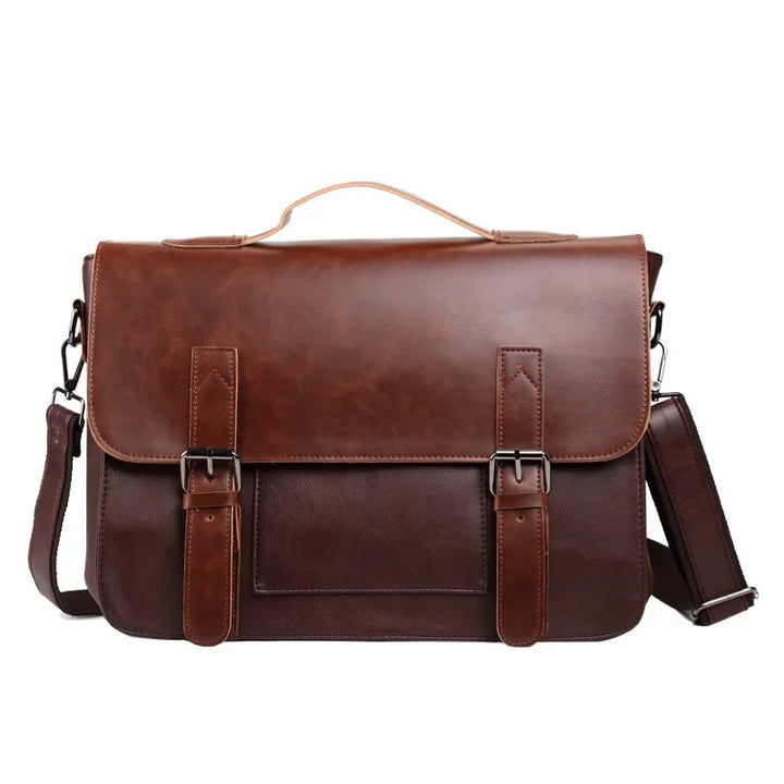 A brown messenger bag crafted from premium leather with a top handle, front flap, two buckle straps, a spacious interior, and an adjustable shoulder strap, set against a white background.