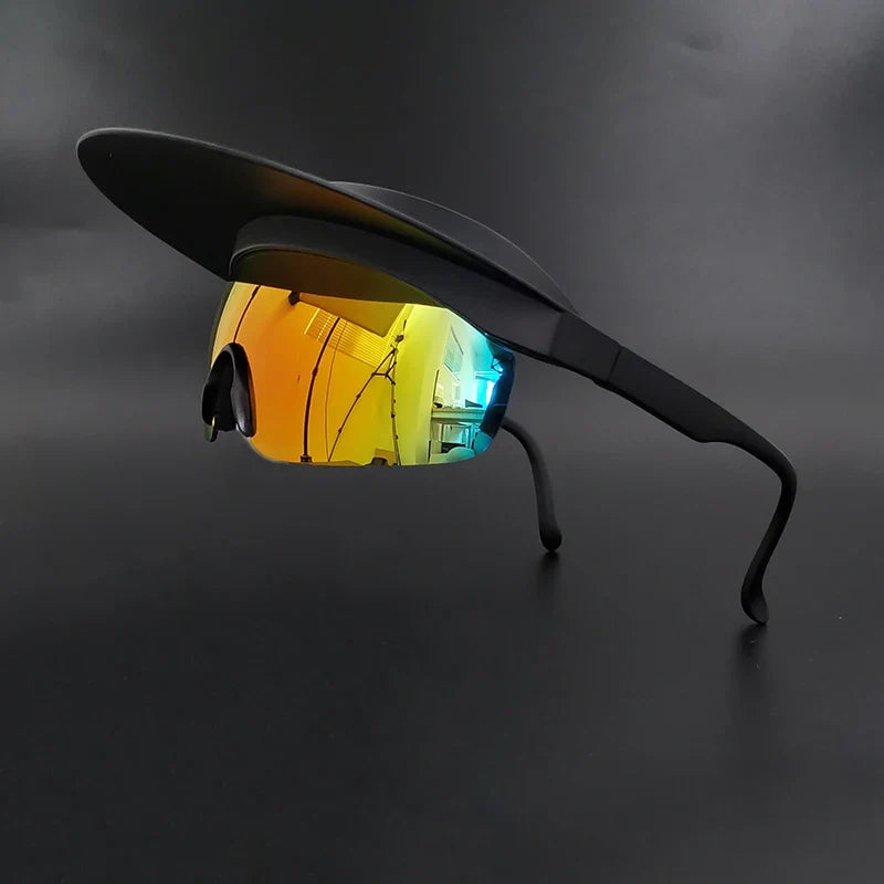 Sunglasses with a black visor attached on top and mirrored, multicolored lenses offer UV400 protection and panoramic visibility, displayed against a plain dark background.