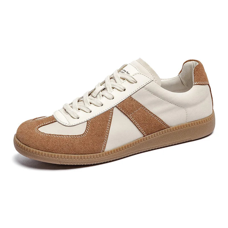 A beige and brown sneaker with premium cow suede and leather panels, white laces, a tan rubber sole, and EVA midsole cushioning is shown on a white background.