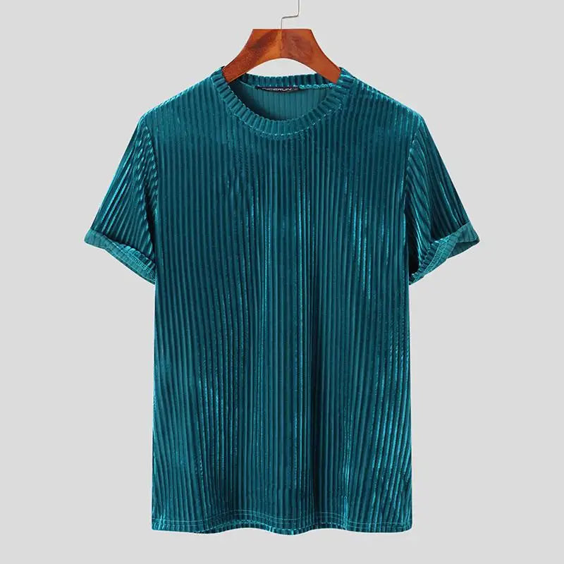 Teal short-sleeve velvet T-shirt with a classic fit and vertical ribbed texture, displayed on a wooden hanger against a plain light gray background.