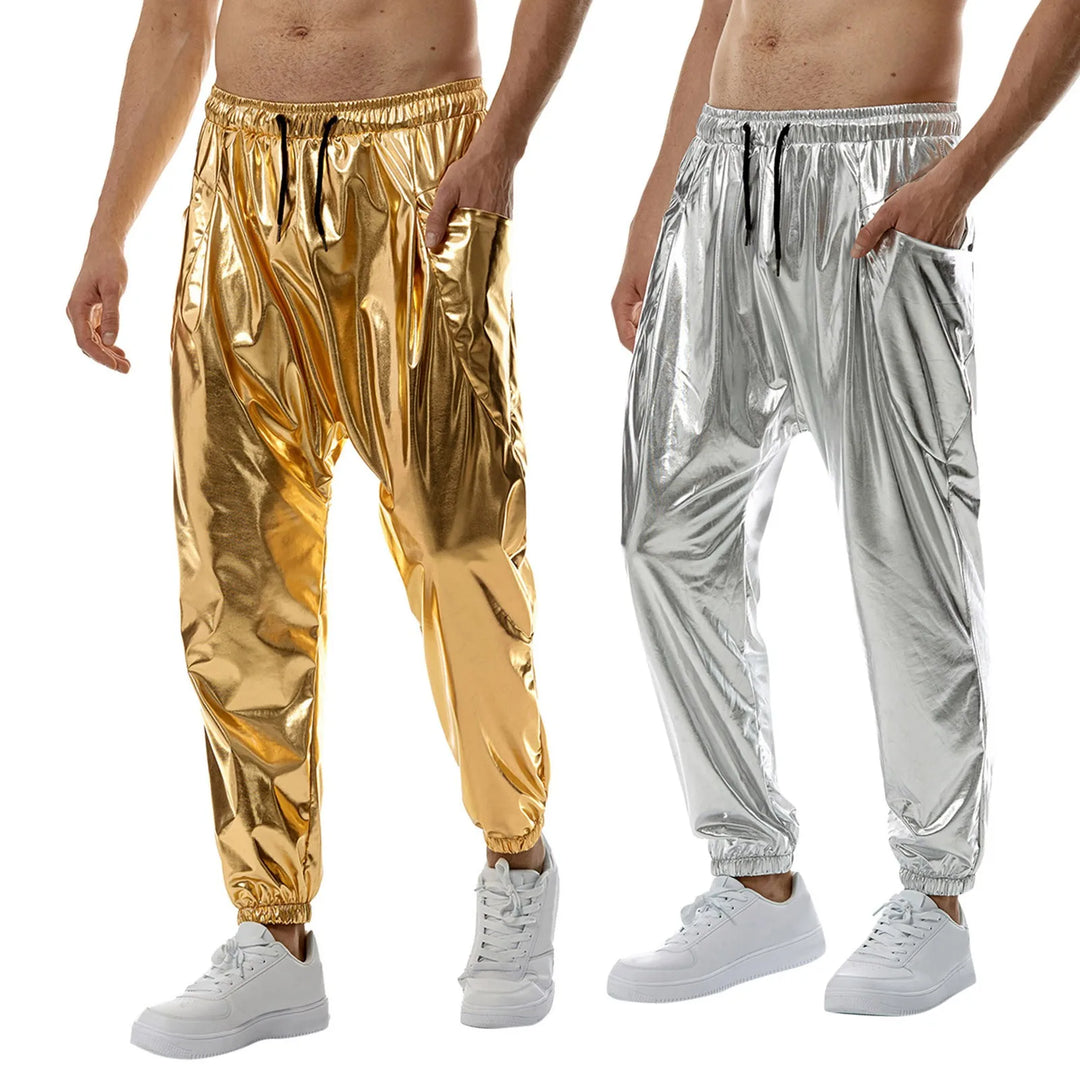 Two men wearing shiny metallic jogger pants crafted from lightweight metallic fabric—one in gold, one in silver—each featuring a tapered leg, elastic waistband, black drawstrings, and white sneakers, standing against a white background.