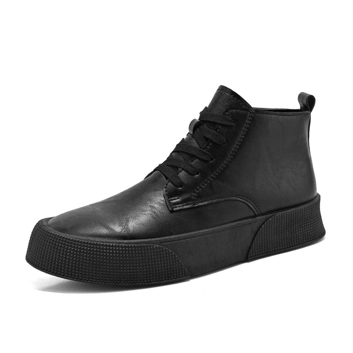 A black vintage-inspired high-top sneaker with a thick, textured sole and black laces, featuring a cushioned footbed, shown at an angle on a white background.