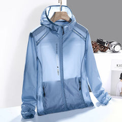 A light blue, hooded, zip-up windbreaker jacket hangs on a wooden hanger. Made from quick-dry material, the jacket has black zipper pockets and “Exercise Training” text on the front. A desk with headphones and books is in the background.