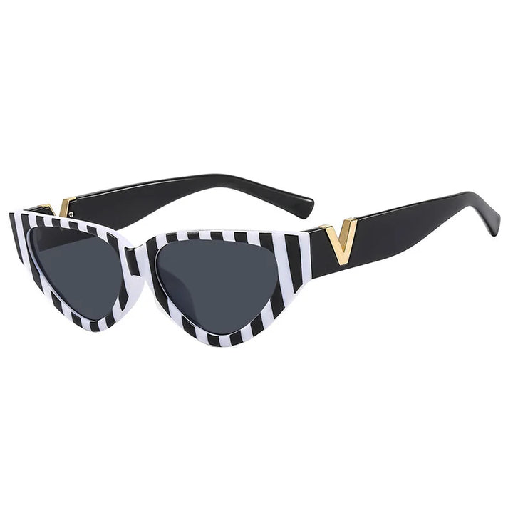 Black vintage cat eye sunglasses with bold white and black stripes on the front frame, UV400 protection, dark tinted lenses, and a gold V detail at the temples. The arms are solid black.