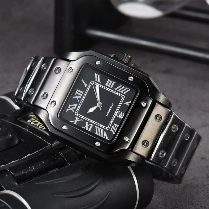A black rectangular wristwatch with a metal band, Roman numerals, and silver accents rests on a dark surface. Showcasing Swiss Craftsmanship, the watch reads 10:10, and part of another object is visible beneath it.